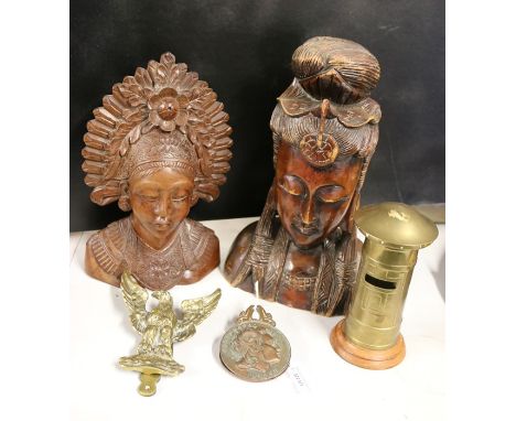 Two hardwood carved busts, brass letter box form money box, brass door knocker in the form of an eagle, Greek copper letter c