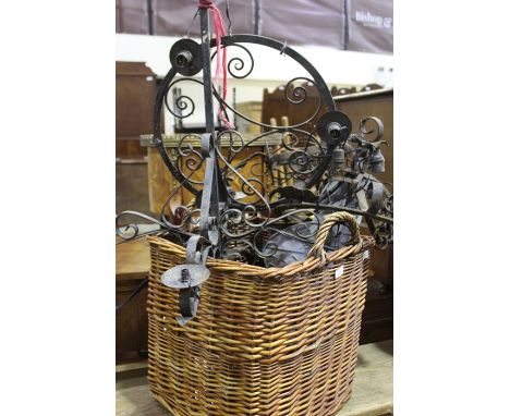 Wicker basket containing a quantity of metal chandeliers and light fittings (qty)