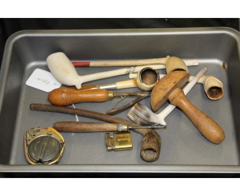 Collection of pipes, to include three clay, a meerschaum, a wood example, together with various tools and a miniature lighter