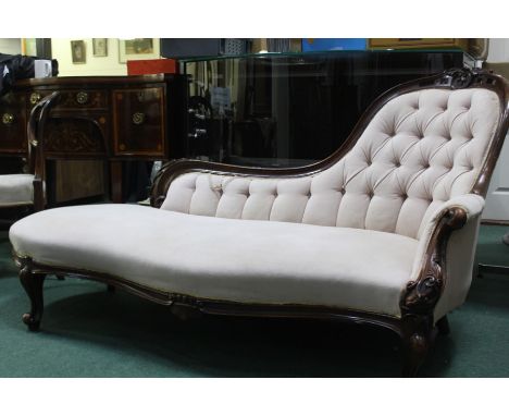 Victorian chaise longue, with button back upholstery, raised on scrolled legs
