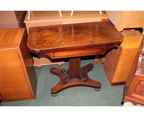 Victorian mahogany card table, the D shaped fold over top revealing a green baize lined playing surface, on a scroll carved s