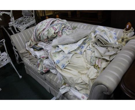 Laura Ashley, a Knoll-style drop-end sofa in light stripes with rope-tassels