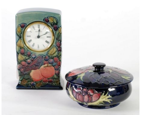 A MODERN WALTER MOORCROFT POTTERY SHALLOW COVERED BOWL, decorated with flowers on a dark blue ground, also a MODERN WALTER MO