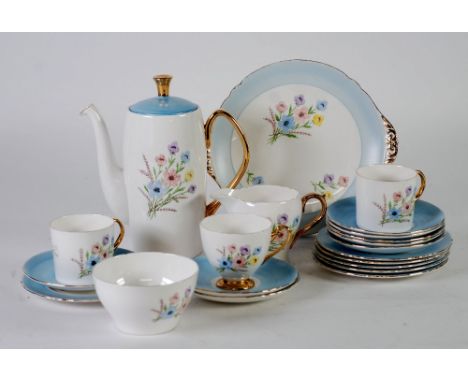 THIRTY FOUR PIECE 1950s/60s SHELLEY CHINA TEA AND COFFEE SERVICE FOR SIX PERSONS, outside decorated with floral sprays, blue 