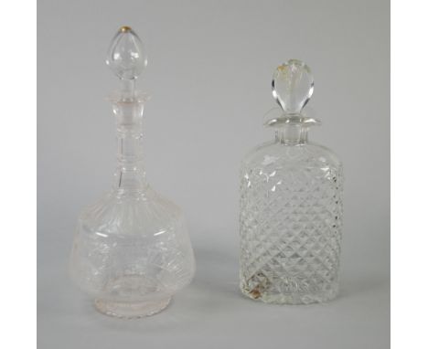 A CUT GLASS MALLET SHAPED DECANTER with plain tear shaped stopper, the body cut with floral festoons and the long neck with t