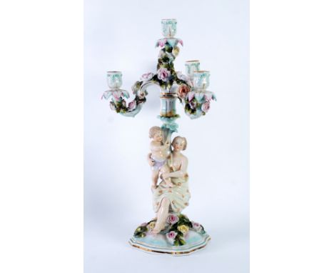 SITZENDORF, GERMAN PORCELAIN FIGURAL FOUR LIGHT CANDELABRUM, with removable top having three 'S' scroll and rose encrusted br