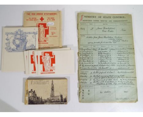 A lot to include a postcard book of Arras, France showing destruction of the city in World War One, a Red Cross Society stati