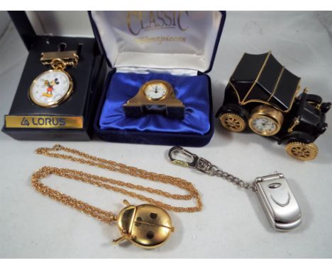A collection of five novelty clocks and watches to include a Lorus Mickey Mouse pocket watch with box, a Ronica novelty watch