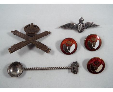 A lot to include a Machine Gun Corp cap badge, silver RAF badge, stamped 925, two sterling silver and enamel Blood Donor badg