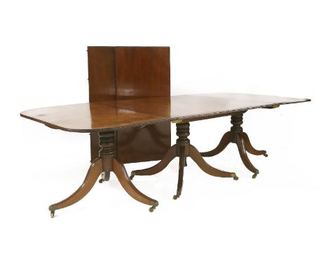 A George III mahogany three-pillar dining table,with two extra leaves,261cm long382cm extended Provenance:  The Priory, Walsh