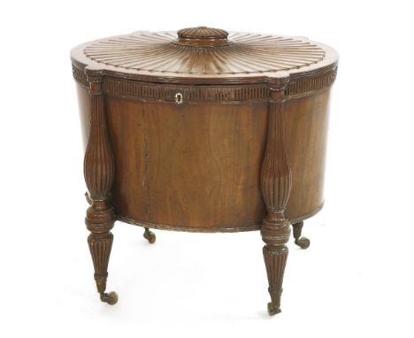 A Regency mahogany oval cellaret, c.1810, attributed to Gillows, with a fluted and radiating top centred with a finial, openi