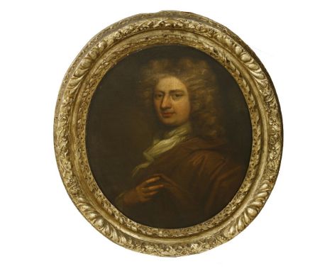Circle of John Riley (1646-1691)PORTRAIT OF A GENTLEMAN, HALF LENGTH, IN A BROWN CLOAKOil on canvas, oval75 x 62cm, in a 17th