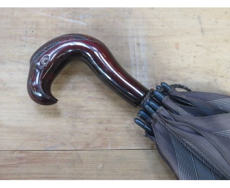 VINTAGE PARASOL WITH CHERRY AMBER COLOURED PARROT HANDLE 