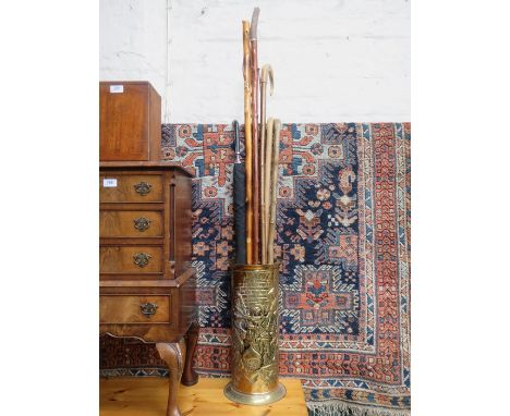 BRASS REPOUSSE STICK STAND AND STICKS, SHEPHERD'S CROOK, PARASOL, ETC. 