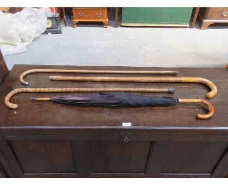 SILVER MOUNTED WALKING STICK, TWO PARASOLS AND ONE OTHER WALKING STICK 