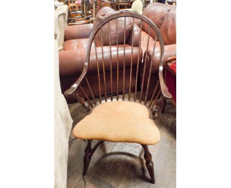 A hooped stick back Windsor elbow chair with upholstered seat 