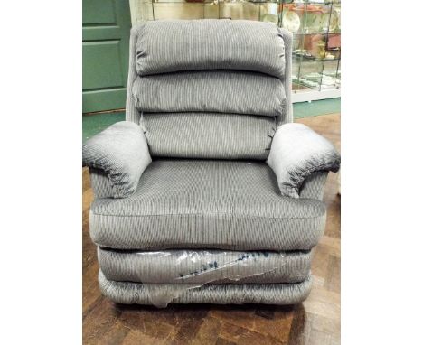 A manual reclining easy chair with rocker in grey striped covering 