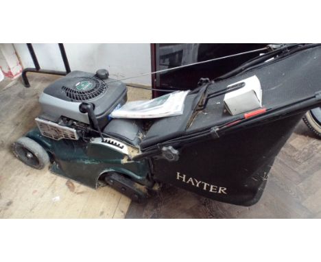A Hayter Harrier self propelled petrol engine lawn mower with electric start and charger