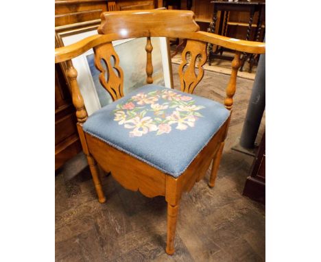 An Edwardian polished corner commode armchair with tapestry seat complete with liner  