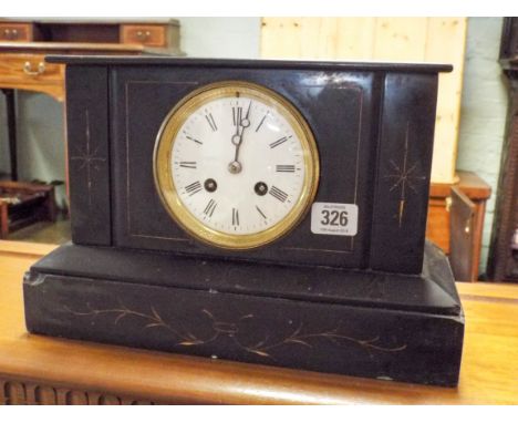 A black marble clock with striking movement 