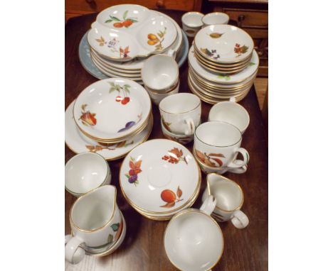 A quantity of Royal Worcester Evesham fruit patterned dinner and tea ware and a large grey patterned plate 