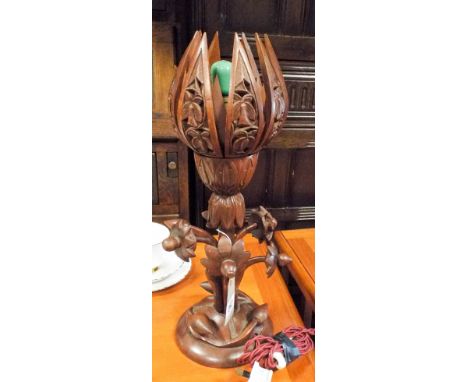 A carved wood lotus table lamp 