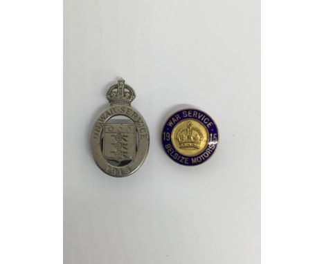 2 WW1 home front badges. To include: a 1915 ‘On War Service’ oval badge, with button hole fitting to the reverse. By D.C. Col