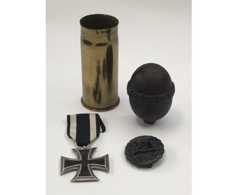A small selection of German WW1 items. To include: an Iron Cross 2nd class, with usual 3 part construction, and painted iron 