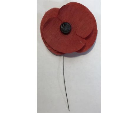 A Rear early ‘Haig Fund’ Poppy in good condition with original button Centre and wire suspension. Approximately 6.5cm diamete