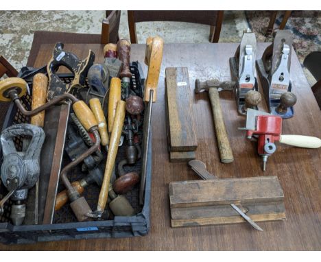 A small box of woodworking tools to include a Salmon's and Stanley planes, drills, saws and other itemsLocation: 