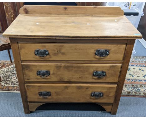A late Victorian pine chest of three drawers having a raised back and on bracket shaped feet, 89cm h x 91cm wLocation: 