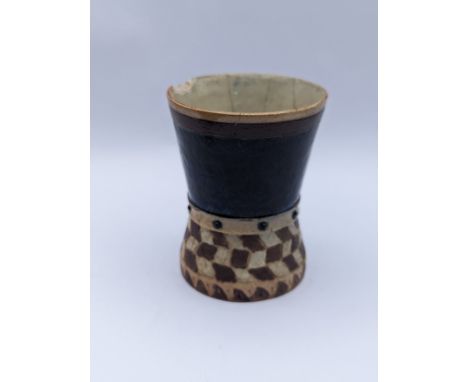A Martin Brothers stoneware beaker, the waisted cylindrical form with geometric decoration, the lower half with chequerboard 