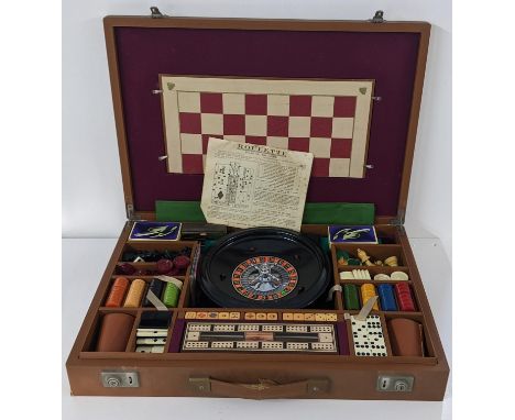 A brown leather cased games set including roulette, chess etcLocation: 