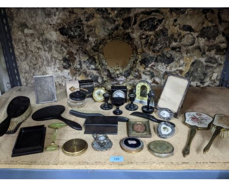 A mixed lot to include two silver strict photograph frames and one other dressing table brush sets, three vintage compacts, b