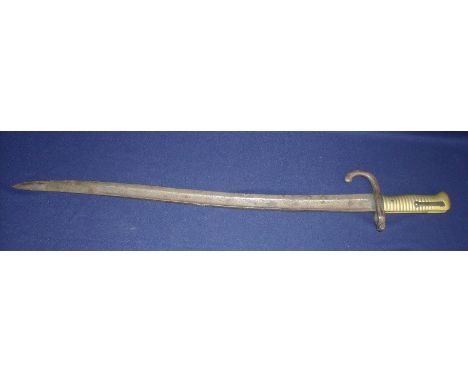 Chassepot bayonet, lacking scabbard, with various stamped marks and serial number to the cross piece 32133, with ribbed brass