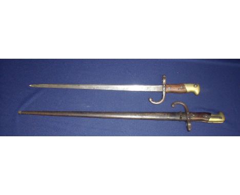 Two Gras type bayonets, one with the top strap dated 1878 the other complete with steel scabbard with serial no. 88458 (2) 