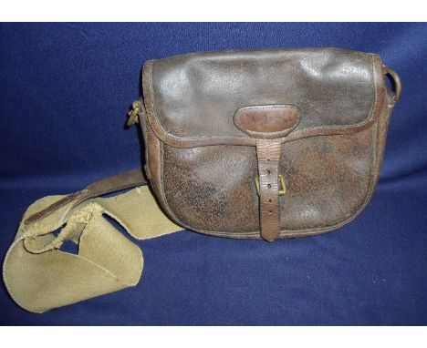 Vintage brown leather cartridge bag with canvas lining and shoulder strap 
