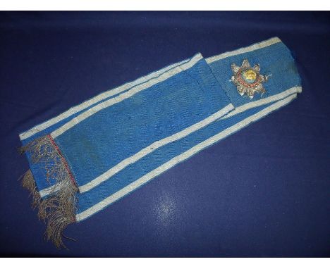Large 19th/20th C sash mounted with embroidered star motif with central pressed gilt metal crest 