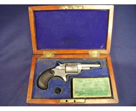 Cased Colt 30 rim-fire revolver with nickle plated finish and 2 1/4 inch barrel, engraved Colt PTF.A.MFG Co Hartford.CT.USA, 