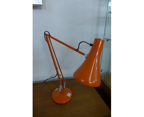 An orange anglepoise lamp