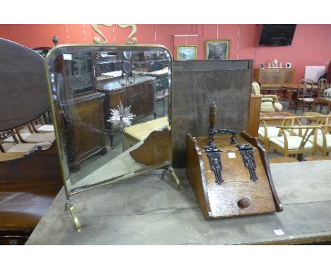 A Victorian brass mirrored firescreen and an Edward VII oak coal scuttle