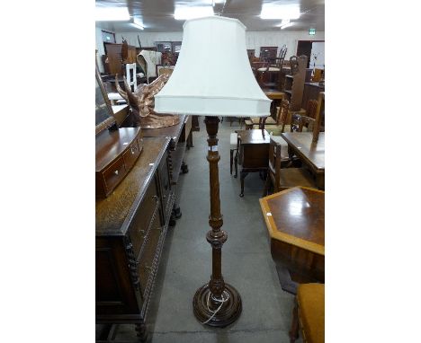 A mahogany standard lamp