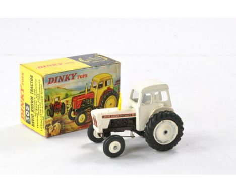 Dinky No. 305 David Brown Tractor. White including rear linkage with dark grey engine block, yellow exhaust. Generally excell