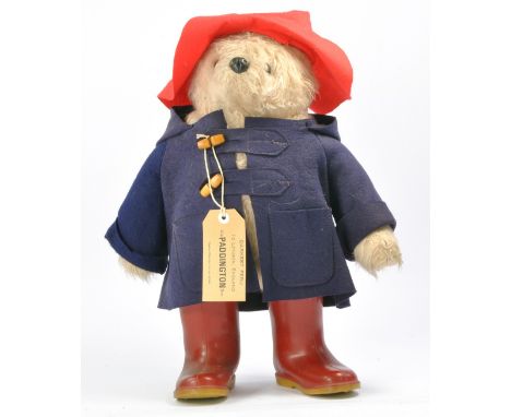 A large 1972 Original Gabrielle Designs Paddington Bear. The plush bear stands 20" tall , wearing his renowned blue duffle co