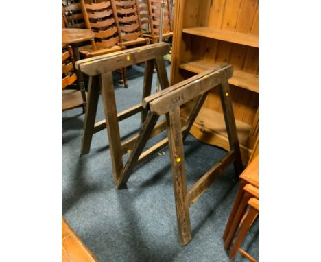 A pair of vintage wooden trestles stamped ‘Bass’ 