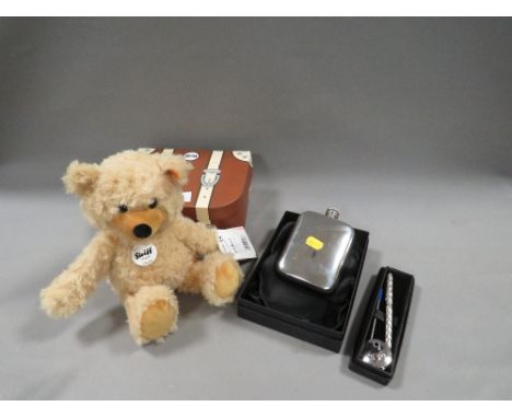 A modern boxed small steiff bear together with a silver plated hip flask etc 
