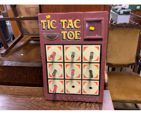 A vintage tic-tac-toe pub game board