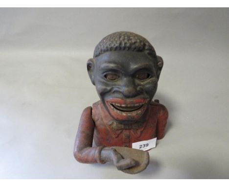 A vintage articulated money bank Notice from the the-saleroom.com: These items are listed on the basis they are illustrative 