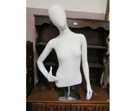 A female half mannequin on stand 