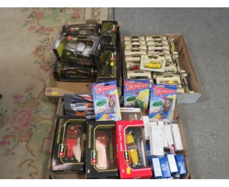 Three trays of assorted vintage toys to include  boxed Burago examples, three carded Matchbox Thunderbird figures, Days Gone 